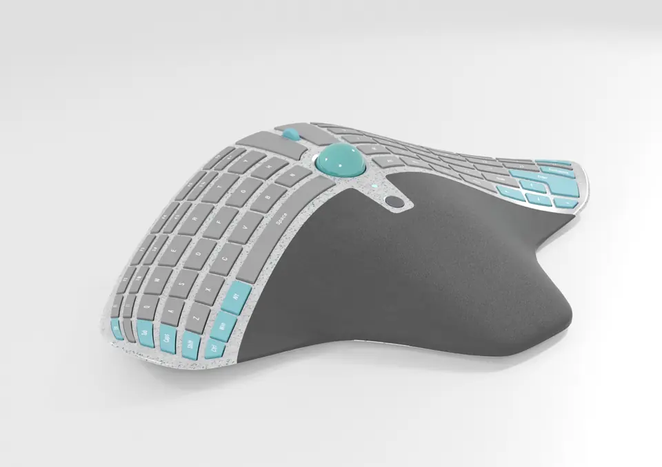 A manta-ray-shaped keyboard in pale speckled recycled plastic with a teal trackball and teal keys, seen from three-quarters on a white ground.