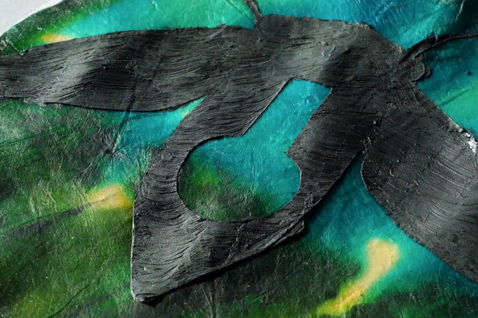 Close-up of dried, dyed cellulose with brushed graphite ink.